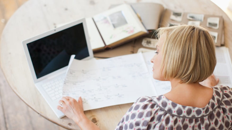 woman examining family tree